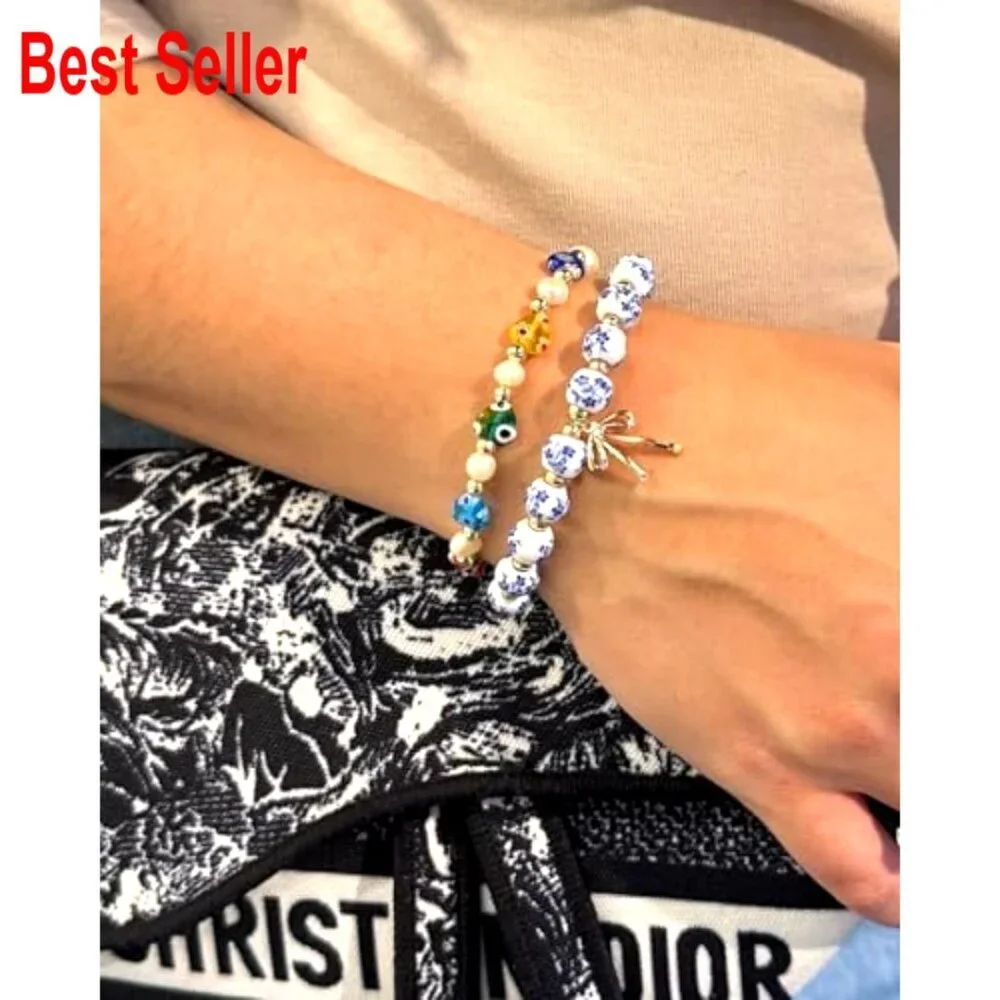 Handmade Stretch Beaded Bracelet with Gold Plated Bow Charm